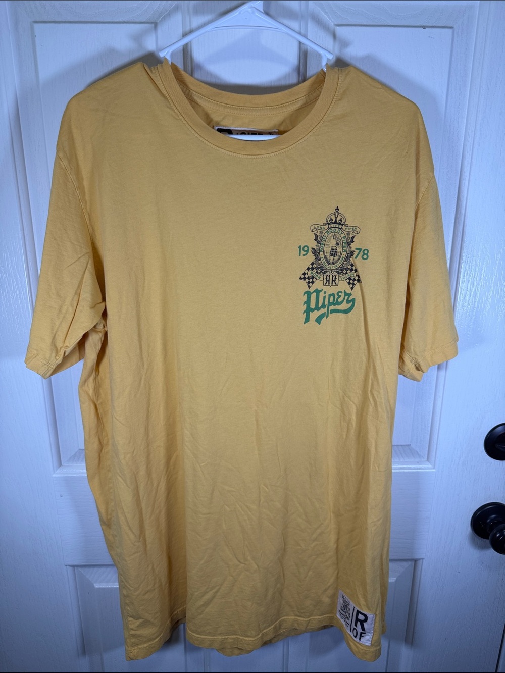 Rowdy Roddy Piper Short-Sleeve Crewneck Tee in Soft Yellow with Green Crest